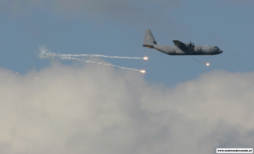 A Danish C-130J deploys flares over the Meppen Range